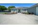 House featuring a manicured front lawn and stone-bordered flower beds at 2563 Se 156Th Place Rd, Summerfield, FL 34491