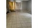 Living room features large-format tile flooring and good natural light at 32 Spring Loop Circle, Ocala, FL 34472