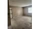 Interior shot of an empty room with tile flooring and light-colored walls at 32 Spring Loop Circle, Ocala, FL 34472