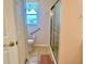 Bathroom showcasing a shower, toilet, and tasteful decor for a comfortable experience at 4998 Nw 30Th Pl, Ocala, FL 34482