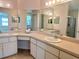 Bathroom featuring double sinks, ample counter space, and a vanity mirror for convenience at 4998 Nw 30Th Pl, Ocala, FL 34482