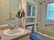 This bathroom features a vanity with sink, medicine cabinet, and bathtub at 4998 Nw 30Th Pl, Ocala, FL 34482