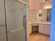 Bathroom featuring a shower with glass door, complemented by neutral tiles at 4998 Nw 30Th Pl, Ocala, FL 34482