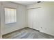 Bright bedroom with carpet flooring, natural light, and a closet for ample storage at 4998 Nw 30Th Pl, Ocala, FL 34482