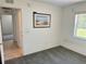 Cozy bedroom featuring carpet flooring, a window view, and a serene setting at 4998 Nw 30Th Pl, Ocala, FL 34482
