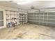 Spacious two car garage with storage shelving and an automatic door opener at 4998 Nw 30Th Pl, Ocala, FL 34482