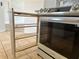 Kitchen featuring stainless steel appliances and a built-in pull-out storage rack next to the oven at 4998 Nw 30Th Pl, Ocala, FL 34482