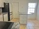 Kitchen with modern appliances, bright cabinets, and an island with granite countertop, offering ample space at 4998 Nw 30Th Pl, Ocala, FL 34482