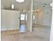 Open living room featuring tiled flooring, views of other rooms, and a decorative light fixture at 4998 Nw 30Th Pl, Ocala, FL 34482