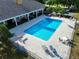 Relax by the community pool with ample lounge chairs and tables for residents at 4998 Nw 30Th Pl, Ocala, FL 34482