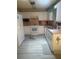 Traditional kitchen features white cabinets, modern appliances, and a spacious layout at 9530 Sw 85Th Ave # B, Ocala, FL 34481