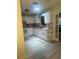 Well-lit kitchen featuring modern appliances, pink countertops, and plenty of cabinet space at 9530 Sw 85Th Ave # B, Ocala, FL 34481