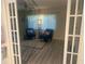 Inviting living room featuring stylish blue chairs, neutral decor, and ample natural light at 9530 Sw 85Th Ave # B, Ocala, FL 34481