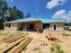 Block home construction in the backyard featuring a covered patio and wood at 9553 Sw 42Nd Ave, Ocala, FL 34476