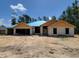 New block home construction shows the exterior elevation and attached garage at 9553 Sw 42Nd Ave, Ocala, FL 34476
