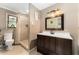 A bathroom featuring a shower, vanity, and toilet at 10060 Se 106Th Ln, Belleview, FL 34420