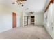 Spacious bedroom with carpet and ceiling fans at 10060 Se 106Th Ln, Belleview, FL 34420