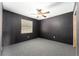 Comfortable bedroom with a modern ceiling fan and plush carpeting for a peaceful retreat at 10060 Se 106Th Ln, Belleview, FL 34420