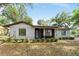 Charming single-story home with inviting curb appeal, showcasing a well-maintained front yard and cozy details at 10060 Se 106Th Ln, Belleview, FL 34420