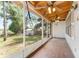 Enjoy a large screened porch, with a view of the backyard at 10060 Se 106Th Ln, Belleview, FL 34420