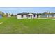 Well-maintained front exterior with lush lawn, enhanced by tasteful landscaping at 1062 Nw 69Th St, Ocala, FL 34474