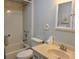 Bathroom features a shower-over-tub, toilet, and vanity with storage, all in a compact and functional space at 11250 Sw 76Th Ave, Ocala, FL 34476