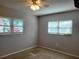 Cozy bedroom with natural lighting from two windows at 11250 Sw 76Th Ave, Ocala, FL 34476