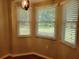 Bright dining room featuring multiple windows and ample natural light at 11250 Sw 76Th Ave, Ocala, FL 34476