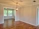 Open dining room with hardwood floors and modern lighting at 11250 Sw 76Th Ave, Ocala, FL 34476