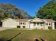 Charming single-story home features a well-maintained lawn and inviting front porch, perfect for enjoying the outdoors at 11250 Sw 76Th Ave, Ocala, FL 34476