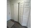 Hallway featuring bi-fold closet with shelving for ample storage space at 12864 Sw 40 Ter, Ocala, FL 34473
