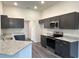 Sleek kitchen featuring granite countertops, stainless steel appliances, and contemporary cabinets at 12864 Sw 40 Ter, Ocala, FL 34473