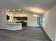 Bright, open kitchen featuring modern appliances, granite countertops, and stylish cabinetry at 12864 Sw 40 Ter, Ocala, FL 34473