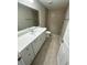 Modern bathroom featuring a tiled shower, vanity, and a large mirror at 13714 Sw 114Th Pl, Dunnellon, FL 34432