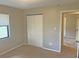 Comfortable bedroom with a spacious closet and natural light from a window at 1400 Ne 54Th St, Ocala, FL 34479