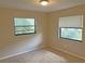 Serene bedroom with windows providing ample natural light and a peaceful atmosphere at 1400 Ne 54Th St, Ocala, FL 34479