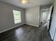 Bright bedroom boasts a ceiling fan and wood-look floors, offering a serene living space at 16331 Se 81St Ct, Summerfield, FL 34491