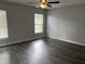 Spacious bedroom offers natural light and wood-look floors at 16331 Se 81St Ct, Summerfield, FL 34491