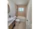Cozy bathroom features a shower and tub combo with a vanity sink, maximizing the space at 23177 Sw Beach Blvd, Dunnellon, FL 34431