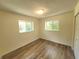 Well-lit bedroom featuring two windows and neutral paint, enhancing the space's calm ambiance at 23177 Sw Beach Blvd, Dunnellon, FL 34431