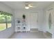 Bright entryway with tiled floors, decorative shelving, and a welcoming ambiance, perfect for guests at 23177 Sw Beach Blvd, Dunnellon, FL 34431