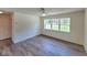Spacious living room filled with natural light from a large window, enhancing the inviting atmosphere at 23177 Sw Beach Blvd, Dunnellon, FL 34431