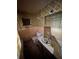 Outdated bathroom with retro tiling, fixtures, and a unique design at 2323 Sw 3Rd St, Ocala, FL 34471
