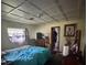 Cluttered bedroom with traditional coffered ceiling and vintage decor at 2323 Sw 3Rd St, Ocala, FL 34471