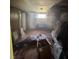 Distressed bedroom with damaged walls, demonstrating renovation potential at 2323 Sw 3Rd St, Ocala, FL 34471