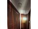 This hallway includes a closet with louvered doors and a small light at 2323 Sw 3Rd St, Ocala, FL 34471