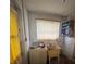 Laundry room with a vintage washer, utility sink, and a window at 2323 Sw 3Rd St, Ocala, FL 34471
