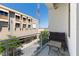 A private balcony with seating and a view of the street and nearby building at 302 Se Broadway St # 330, Ocala, FL 34471