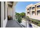 A private balcony with a view of the street and nearby building with seating at 302 Se Broadway St # 330, Ocala, FL 34471