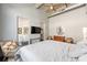 Spacious bedroom with exposed ceilings, TV, and en suite bathroom at 302 Se Broadway St # 330, Ocala, FL 34471